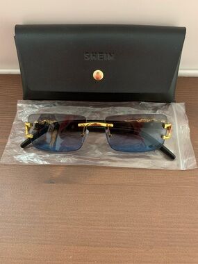 Gold-Accent Rimless Sunglasses with Blue Gradient Lenses
